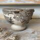 Old bowl made of iron with ceramic seams.