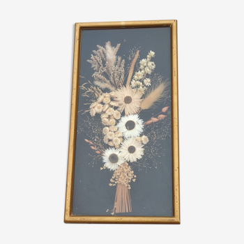 Golden vintage frame of dried flowers