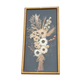 Golden vintage frame of dried flowers