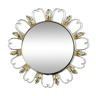 Round mirror on brass frame with scrolls