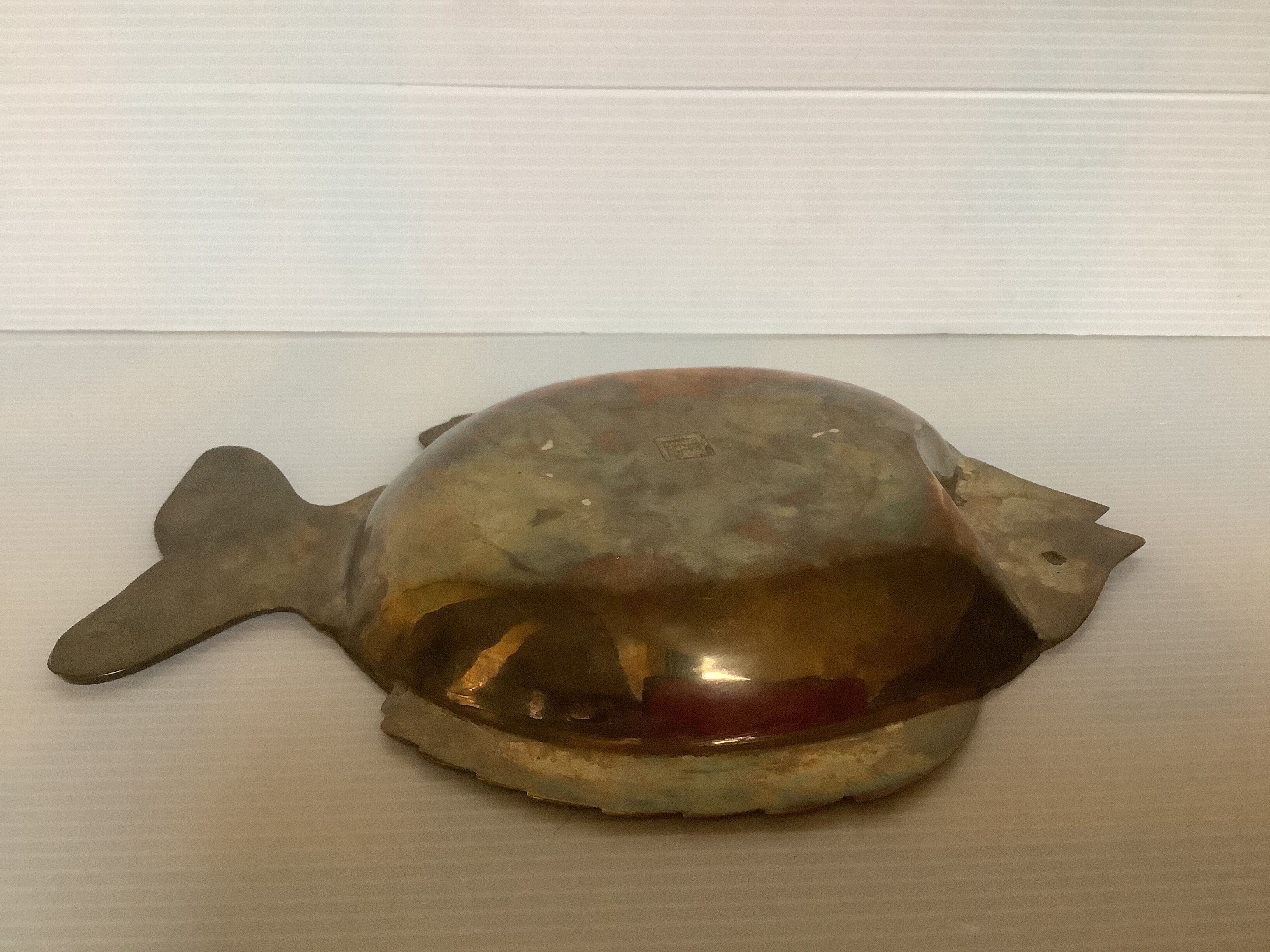 Empty brass fish bag