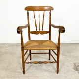 Antique oak and elm wooden armchair with cane seat