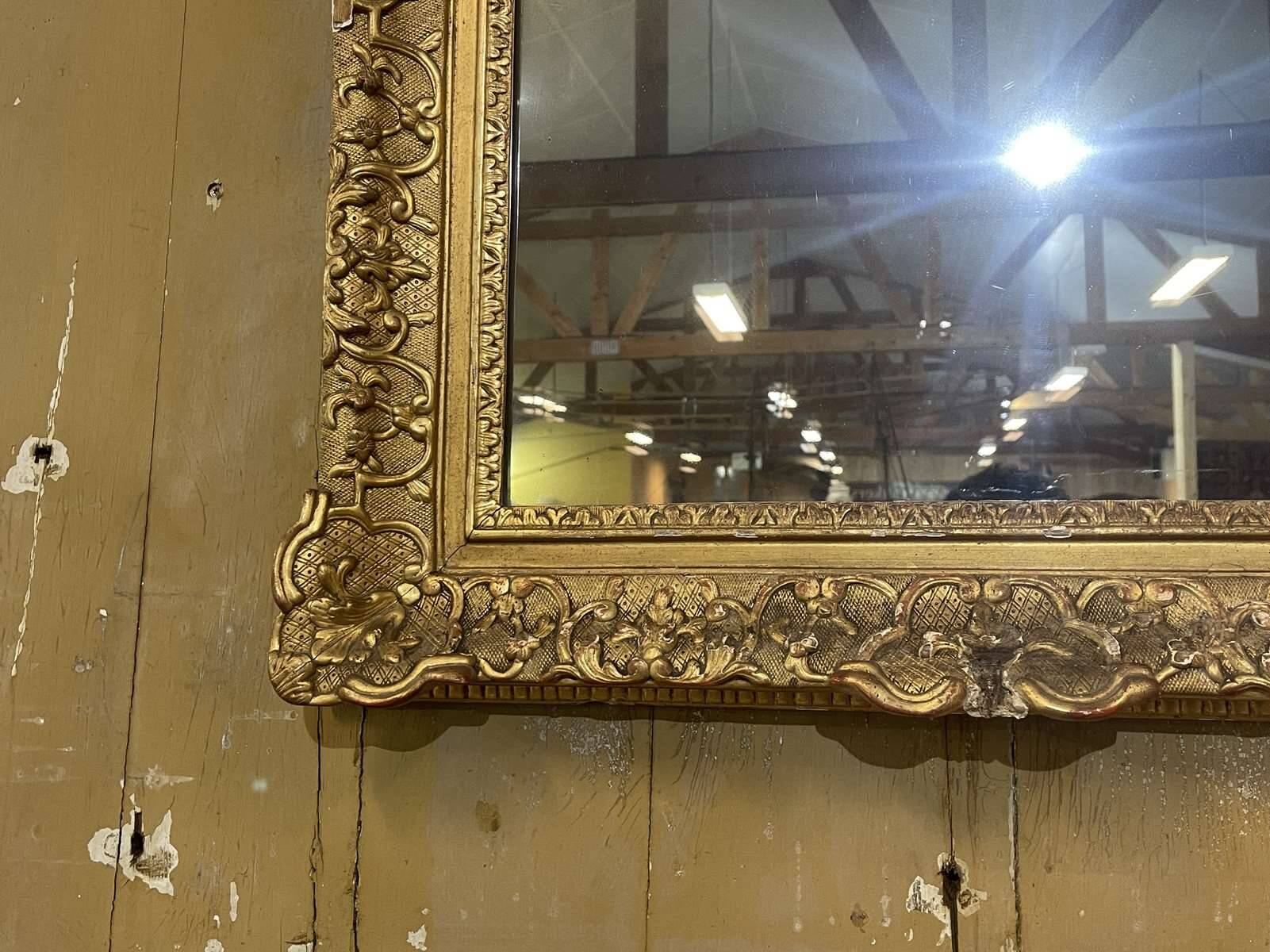 18th century Regency mirror in gilded wood