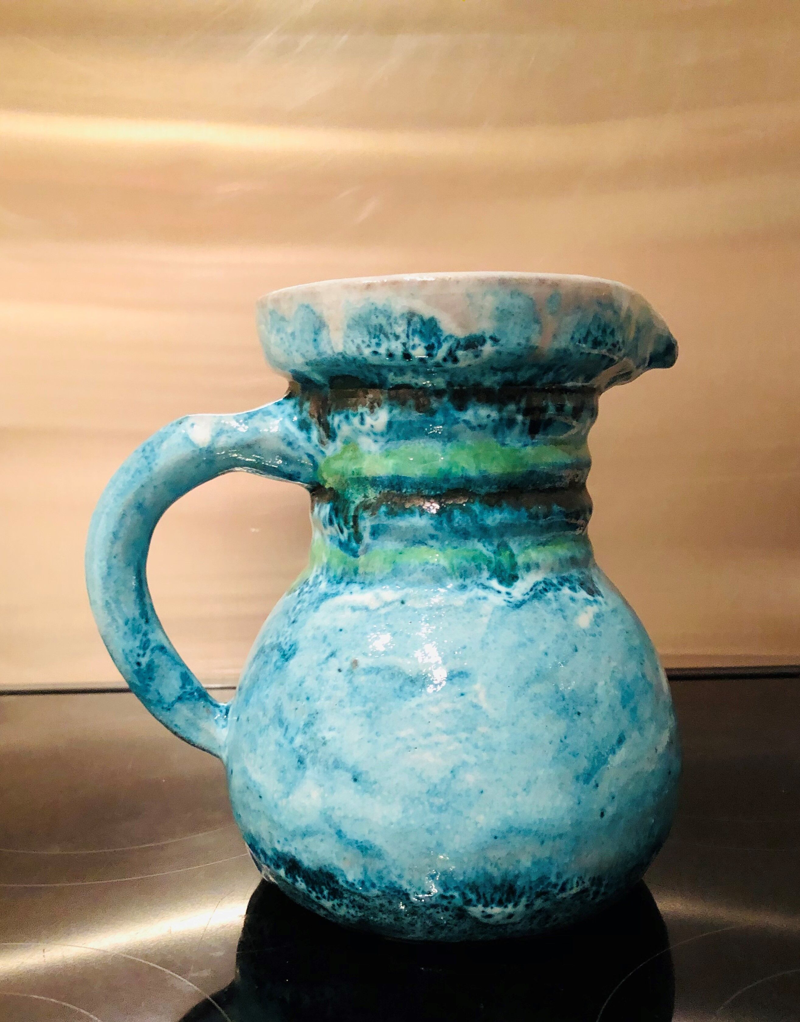 Old pitcher in terracotta signed