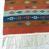 Authentic handmade Tunisian Berber kilim rug in orange wool.