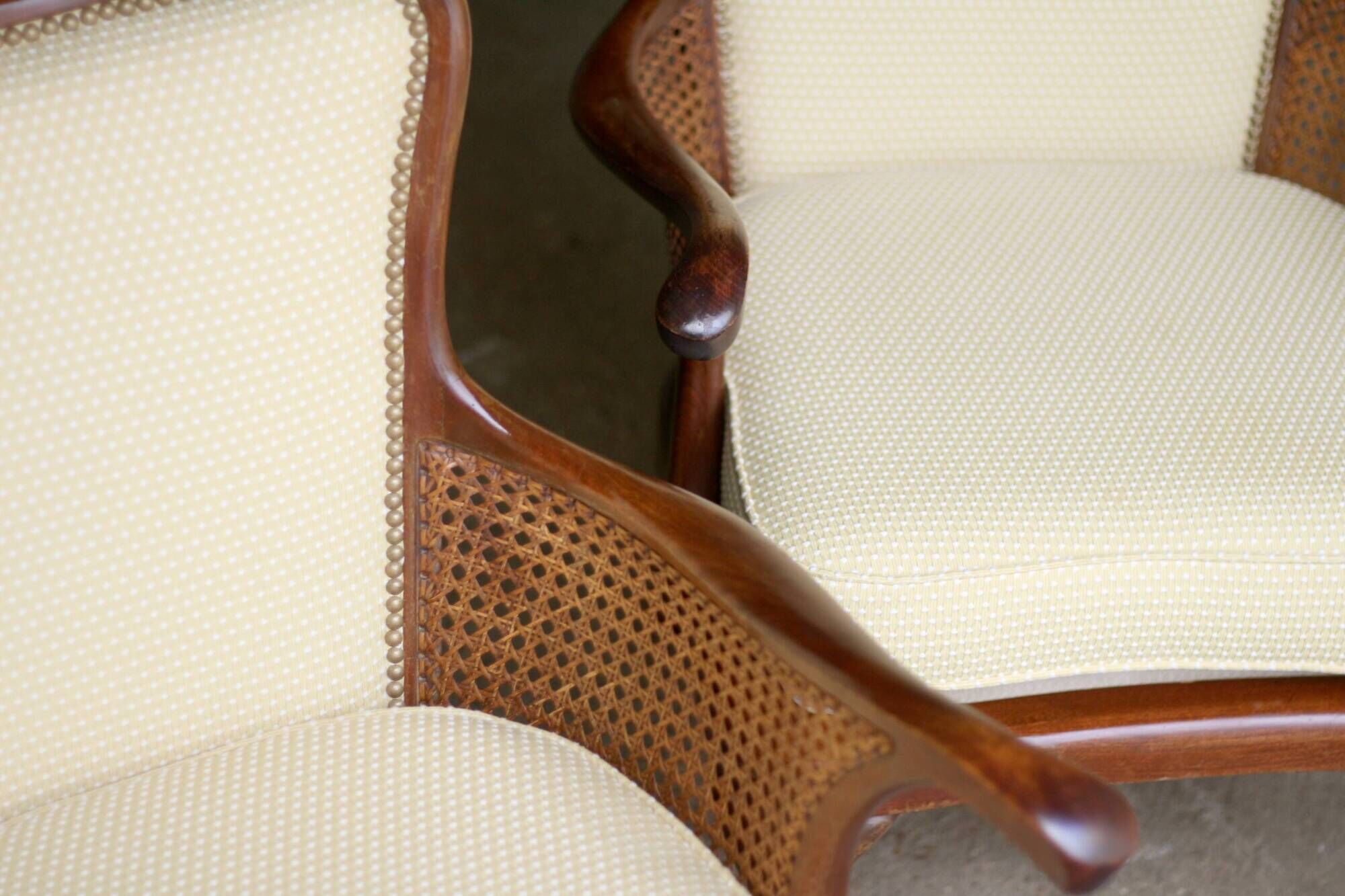 pair of mahogany and cane armchairs. English work (1960s).