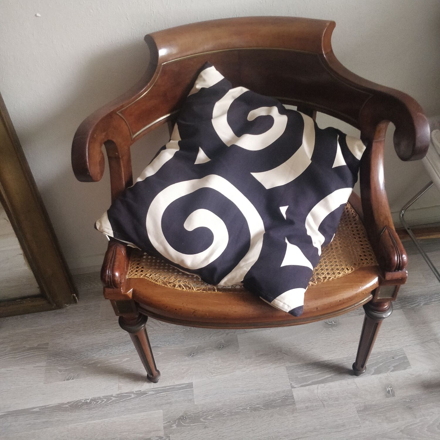 Armchair with canework and bronze detail