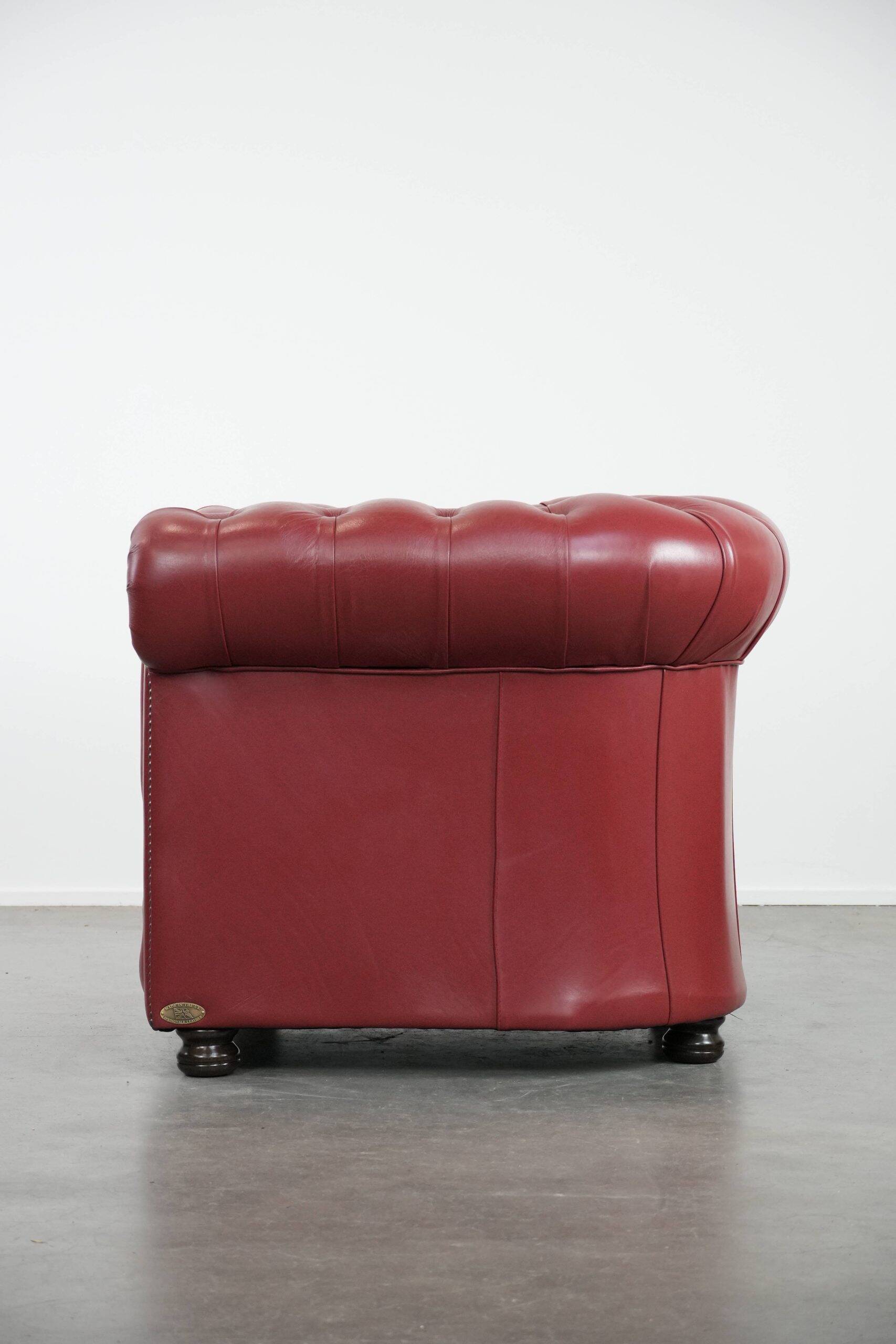 Amazing English cowhide Chesterfield armchair in a stunning red colour