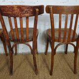 4 mismatched signed bistro chairs