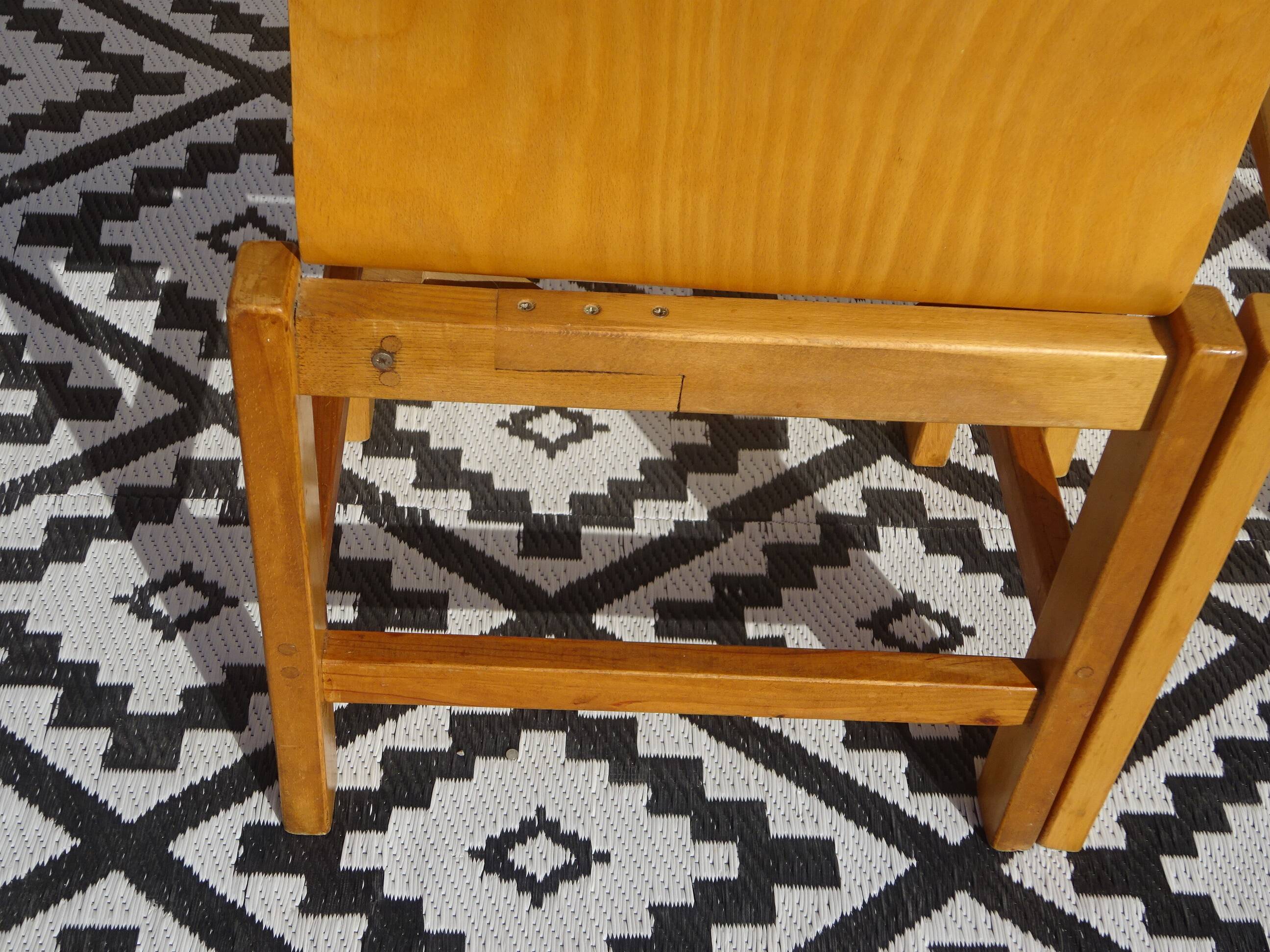 Pair of light wood chairs with post-formed seat and backrest.