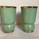 Pair of antique green and gold ceramic vases