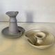 Pair of signed ceramic candlesticks