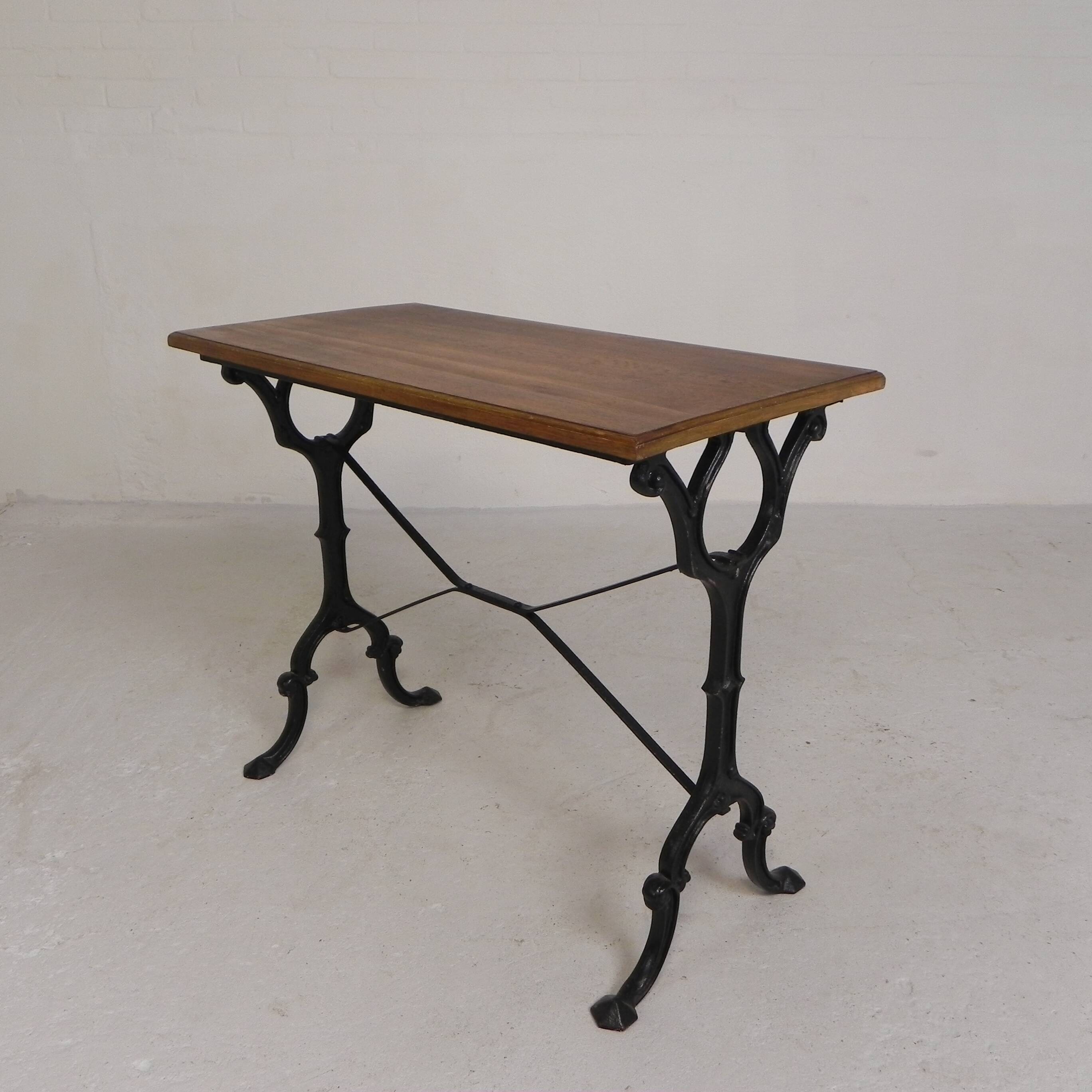 Bistro table with an oak top on a cast iron base, 1930s.