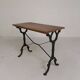 Bistro table with an oak top on a cast iron base, 1930s.