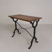Bistro table with an oak top on a cast iron base, 1930s.
