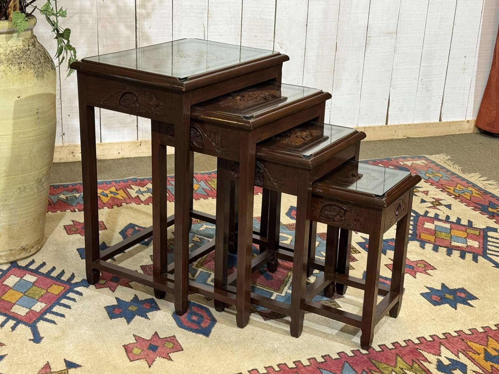Set of 4 Chinese nesting tables in teak from the 1980s.