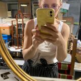 Golden oval mirror
