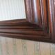 Large mirror in natural stained wood