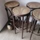 Set of 4 high bistro stools in curved wood and canework.