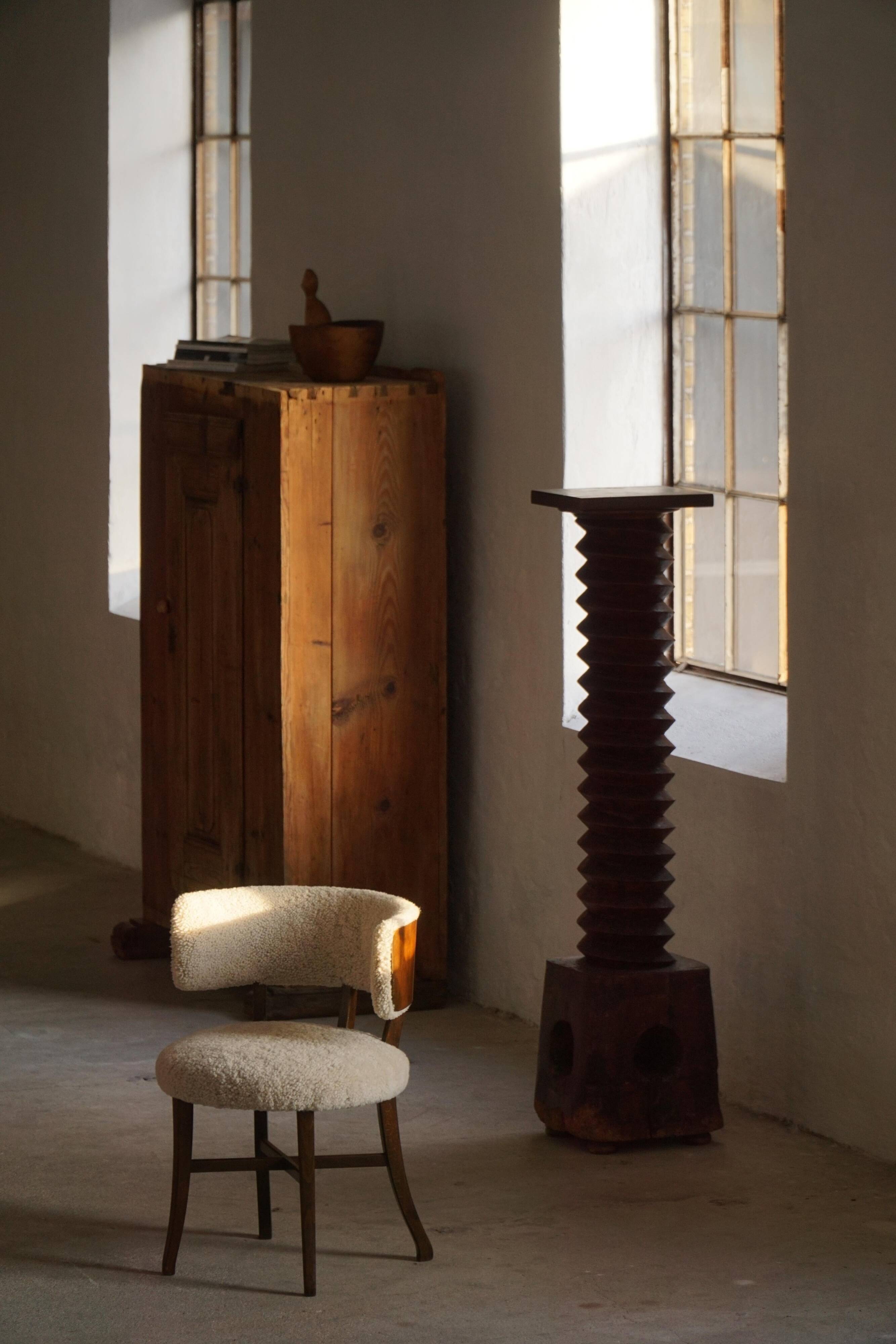 A modern Danish elegant low-back chair, reupholstered in lambswool, 1940s.