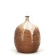 Ovoid vase with a small neck in brown beige ceramic and white drips.