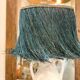 White terracotta lamp and blue raffia lampshade