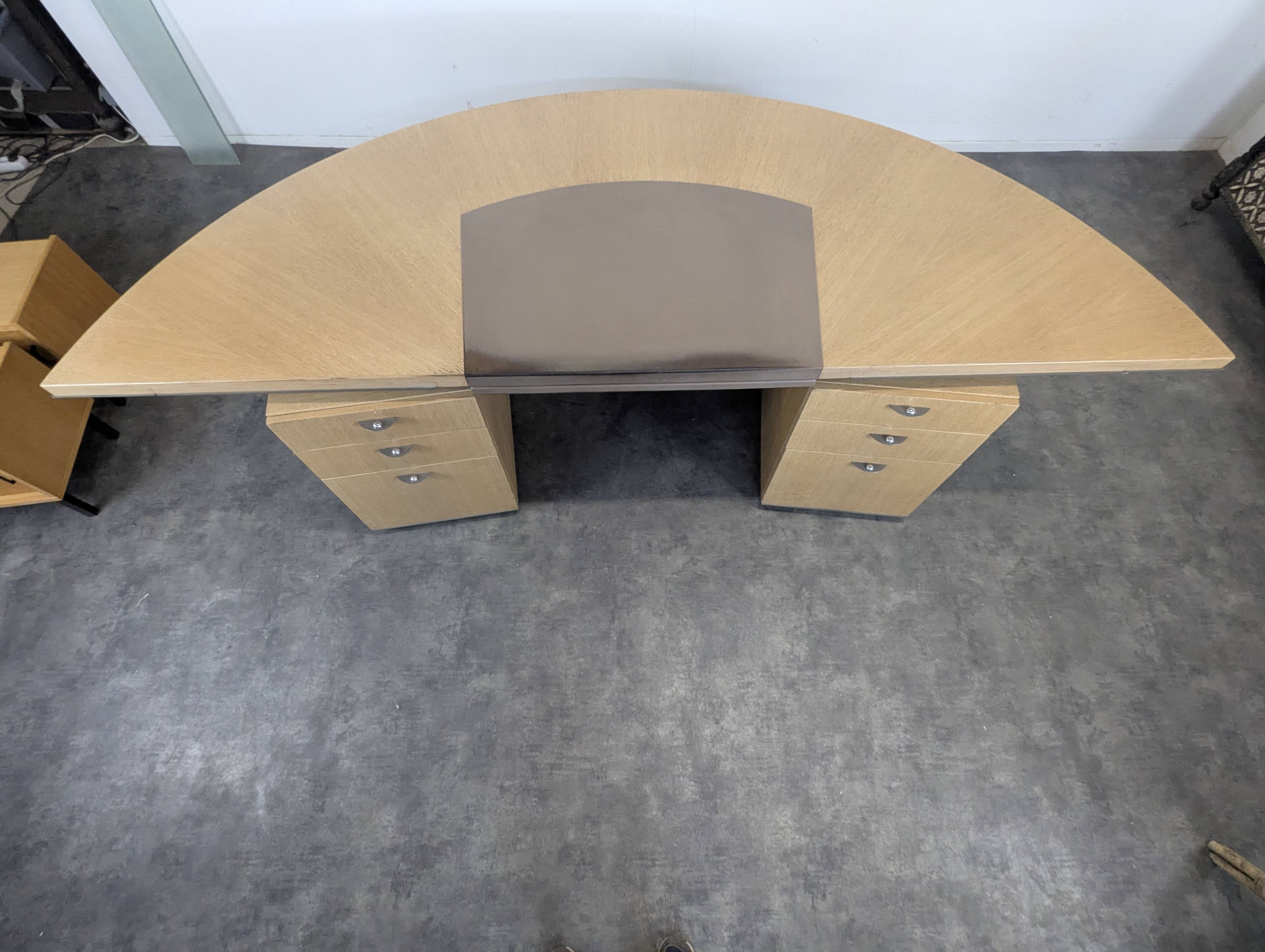 Large semicircular desk by André Putman published by Ecart International.