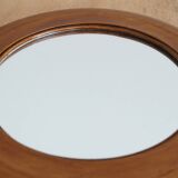 Antique round mirror with turned wooden frame