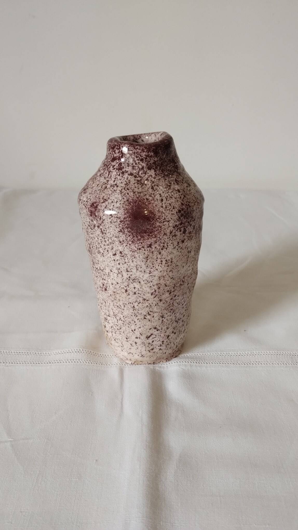 White ceramic vase with brown speckles