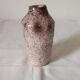 White ceramic vase with brown speckles