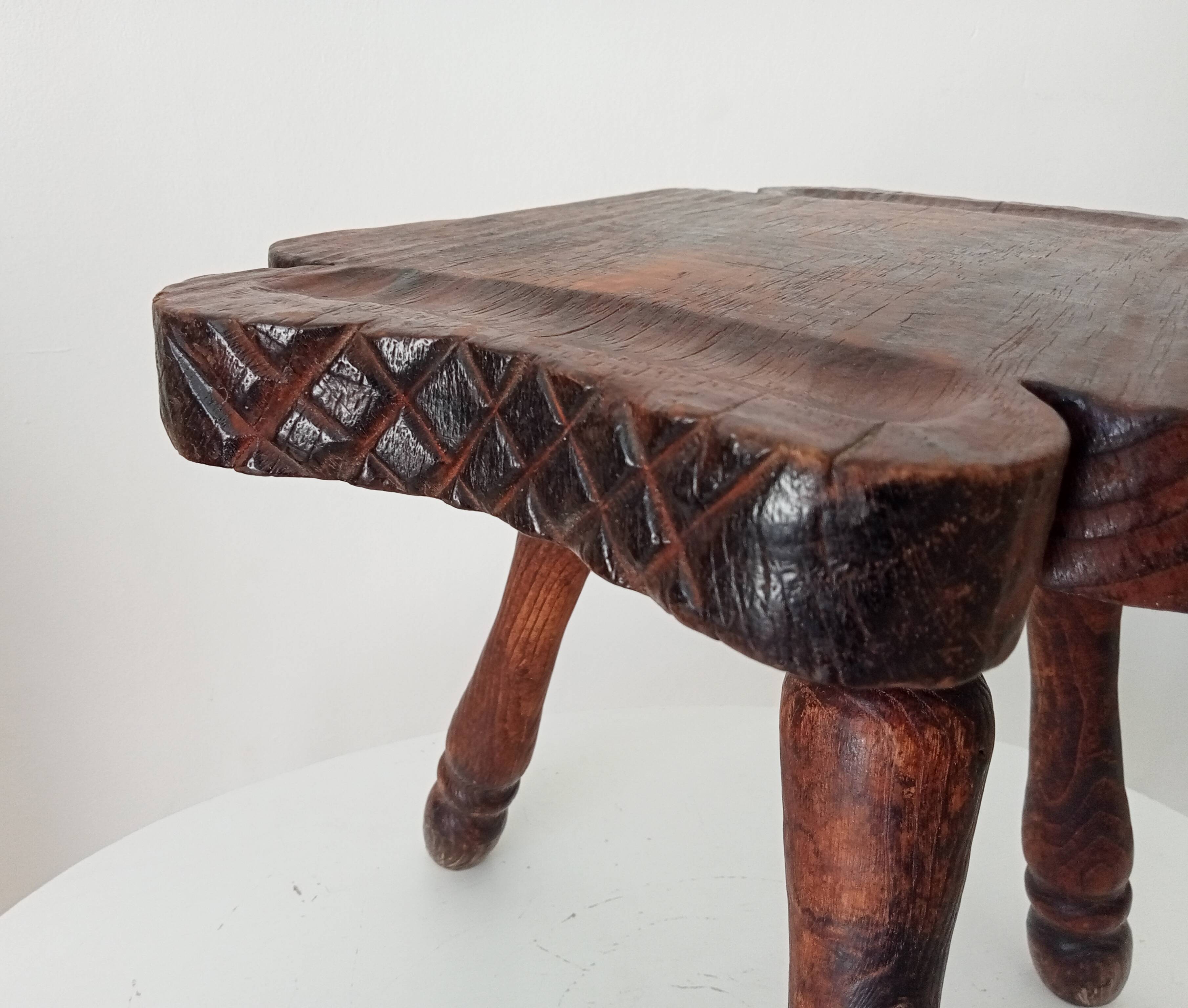 Brutalist Spanish tripod stool in solid carved wood.
