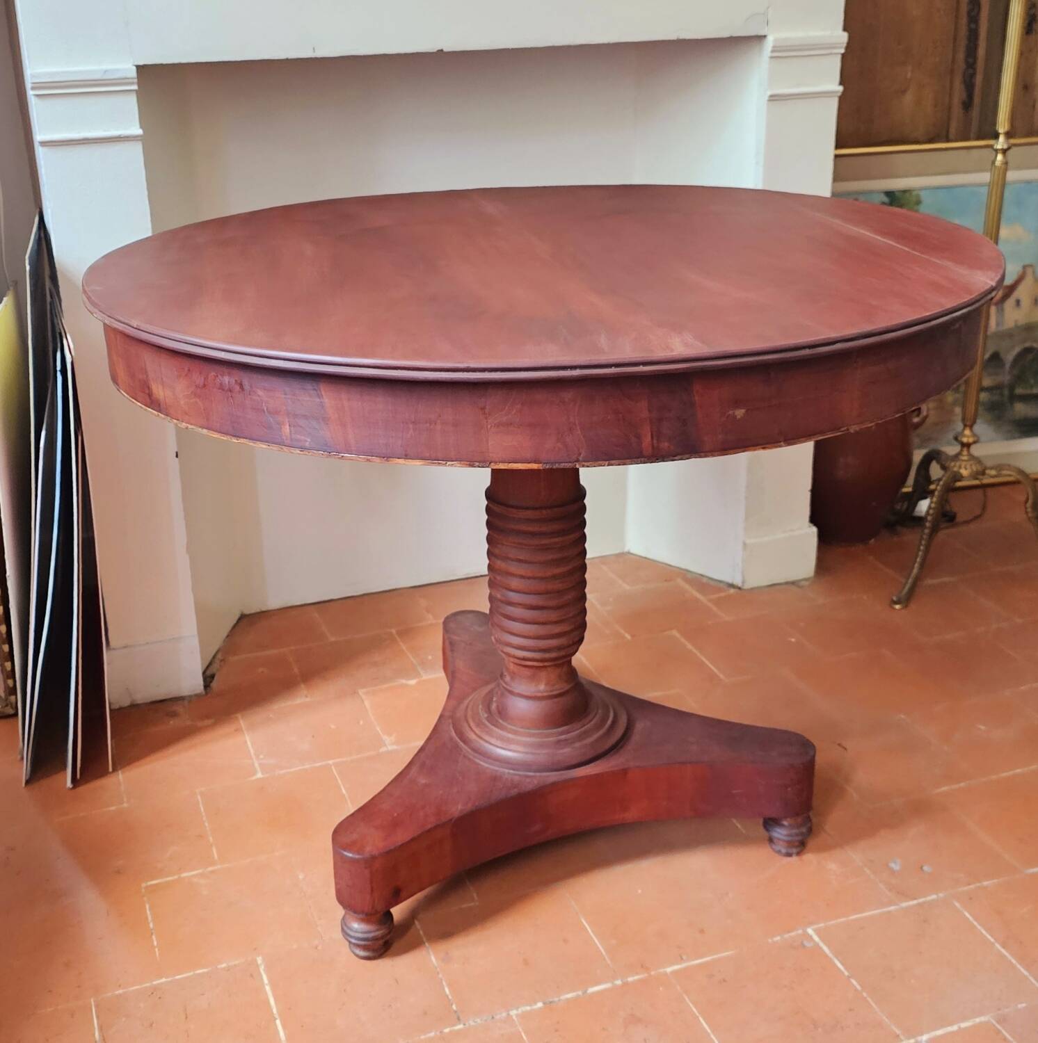 Round table with central tripod leg