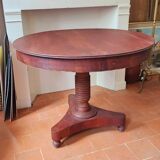 Round table with central tripod leg