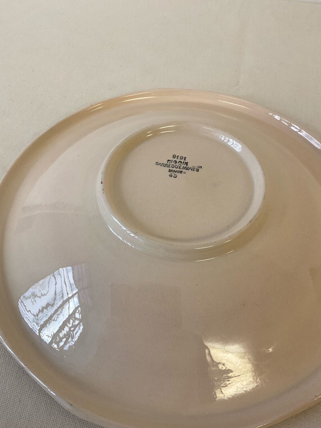 Vintage shallow dish Digoin Sarreguemines with a burgundy rose design.