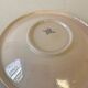 Vintage shallow dish Digoin Sarreguemines with a burgundy rose design.