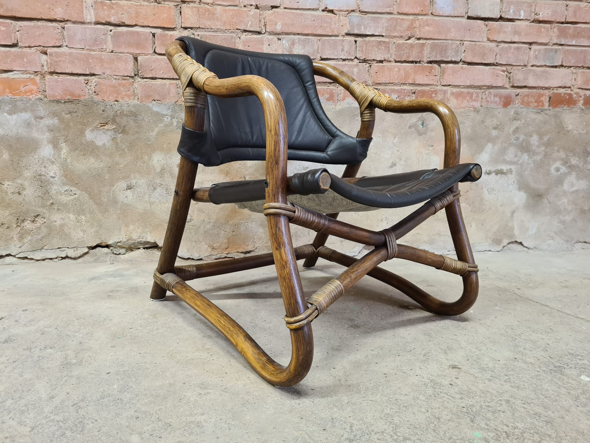 Pair of vintage skaï bamboo armchairs