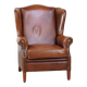 Fauteuil à oreilles en cuir de vachette cognac