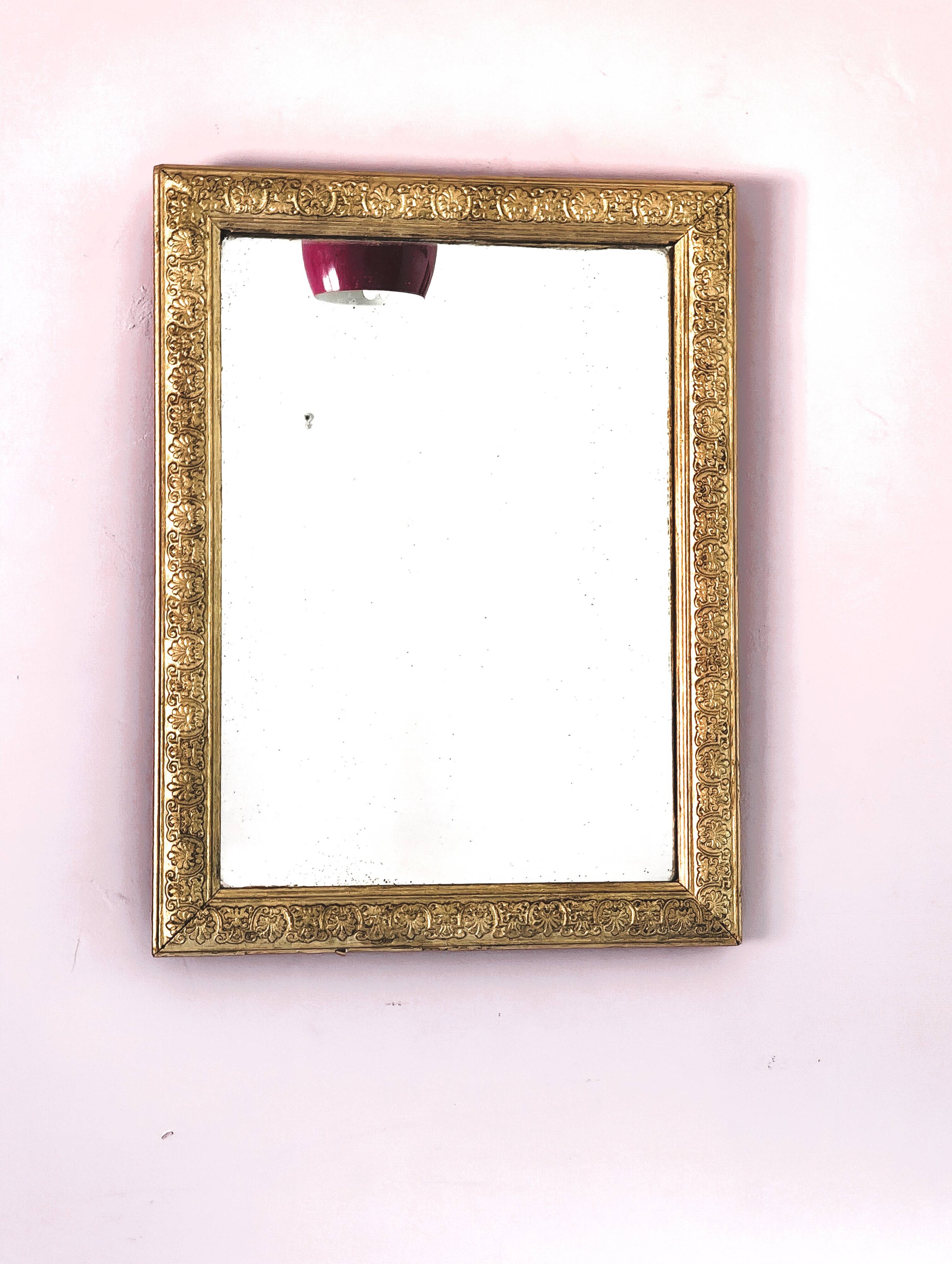 Rectangular wooden mirror with ornate Art Nouveau gold finish.
