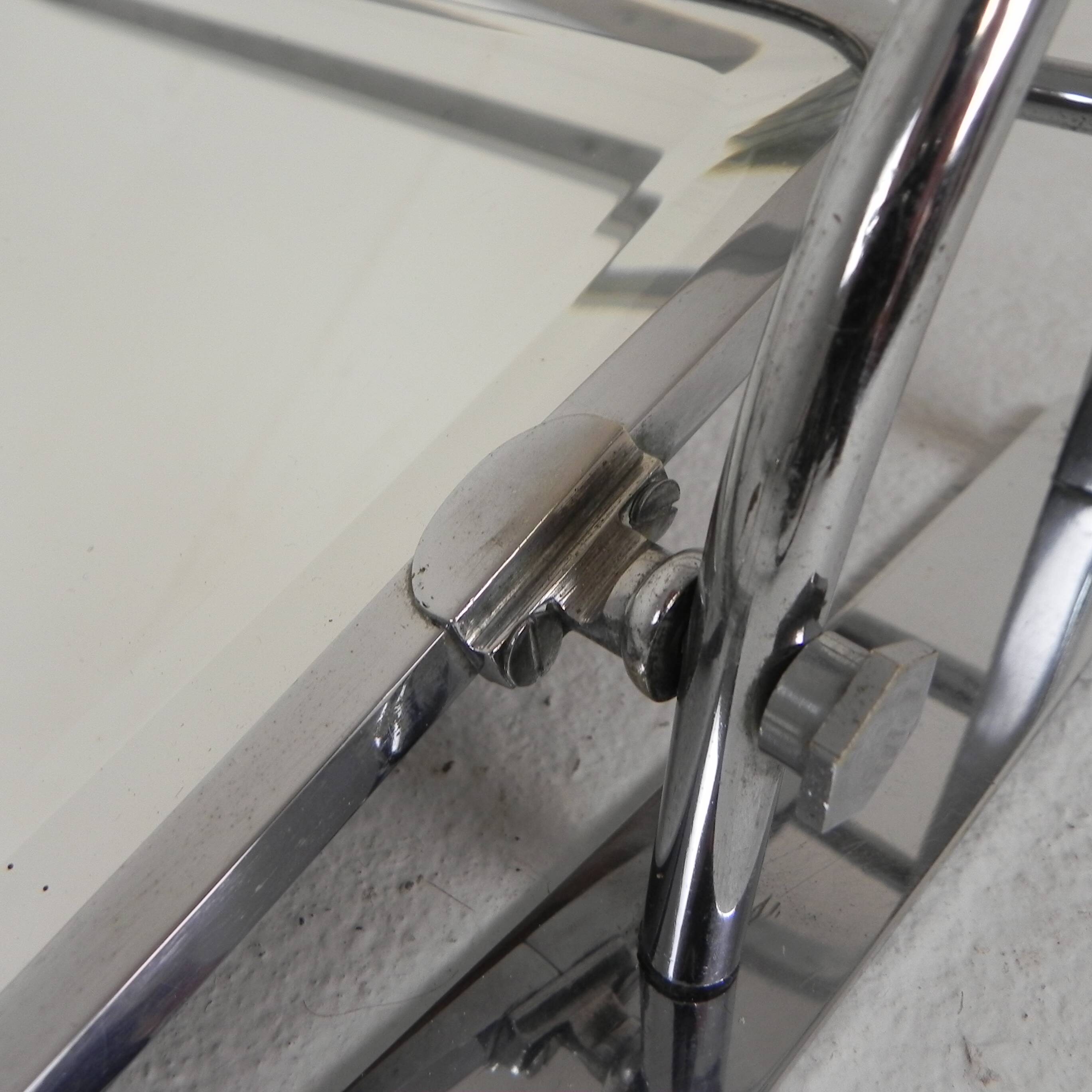 Art Deco wall coat rack with a bevelled mirror adjustable in a chrome frame, 1930s.