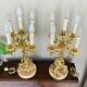 Pair of gilt bronze chandeliers, marble bases.