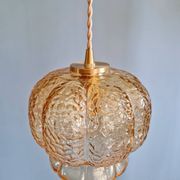 Vintage trio of amber glass pendants, 1960s-70s.
