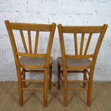 oak tray table with cast iron legs and pair of bistro chairs