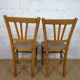oak tray table with cast iron legs and pair of bistro chairs