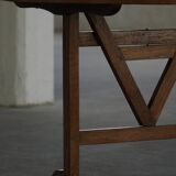 19th-century French round wine table with an adjustable top and floral textile surface.
