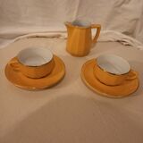 Set of two yellow Apilco coffee cups and saucers and a matching water or milk jar.