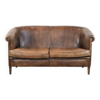 Sturdy vintage 2-seater sofa made of cognac-coloured sheepskin leather