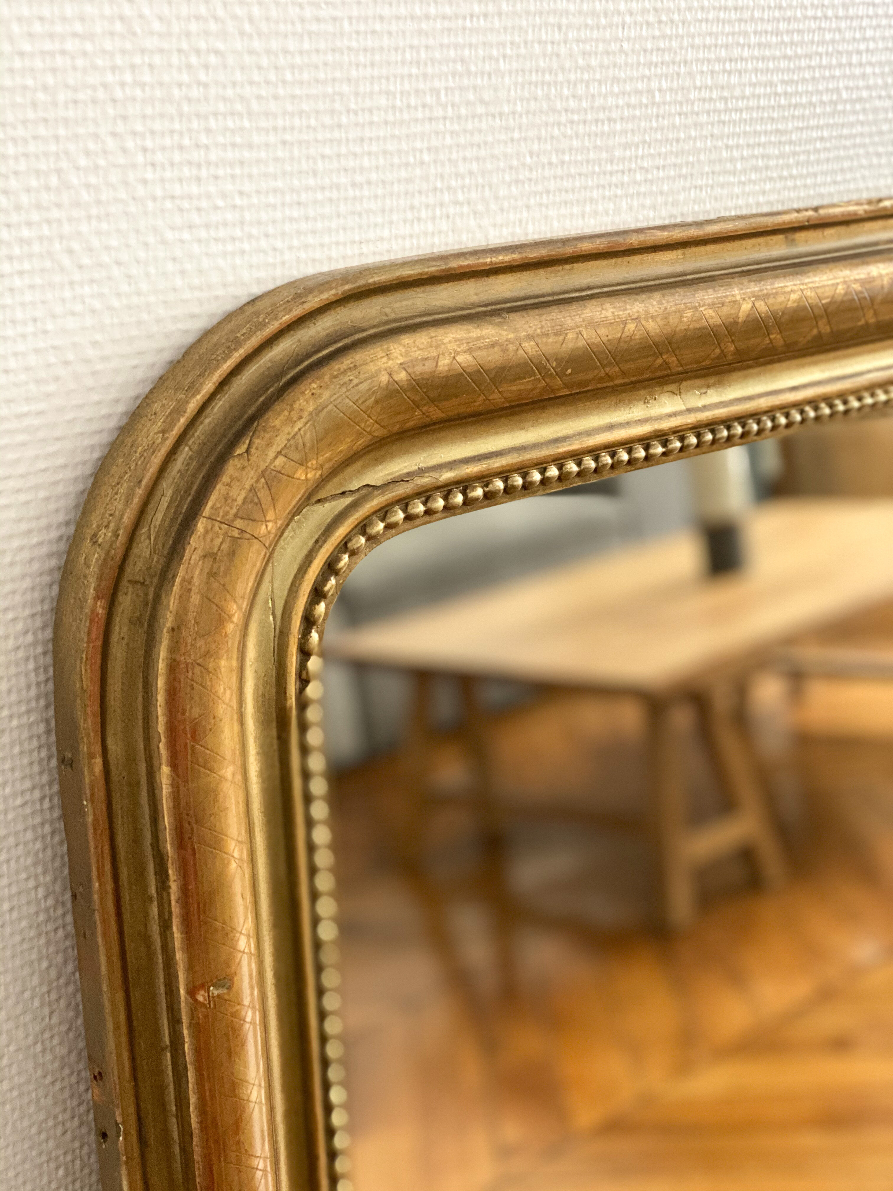 Miroir Louis Philippe perlé doré sculpté 74x98cm