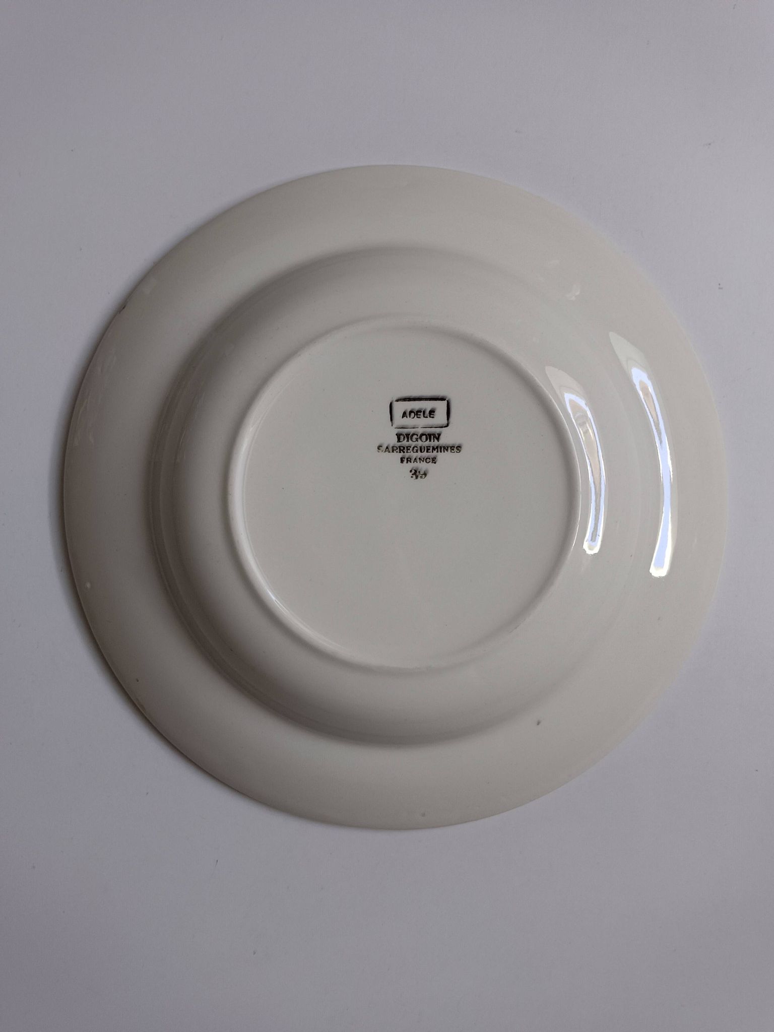 3 Digoin Sarreguemines Adèle plates in grey, yellow, and burgundy.