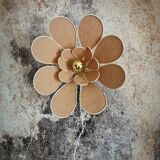 Flower wall light made of rattan and nude linen petals