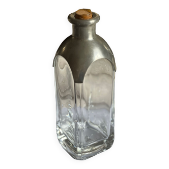 Glass and tin bottle